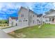 This home features a two-car garage, and manicured front yard at 1294 Six Sisters St, Dacula, GA 30019