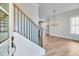 Open foyer with stairs and hardwood floors that lead to the home's interior at 1294 Six Sisters St, Dacula, GA 30019