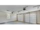 Spacious garage with two white doors and concrete floors at 1294 Six Sisters St, Dacula, GA 30019