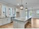 Modern kitchen with stainless steel appliances, granite countertops and natural lighting at 1294 Six Sisters St, Dacula, GA 30019