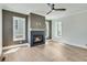 Cozy living room features hardwood floors, shiplap accent wall, and a fireplace at 1294 Six Sisters St, Dacula, GA 30019