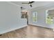 Bright living room features hardwood floors and large windows at 1294 Six Sisters St, Dacula, GA 30019