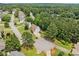 Aerial view of a residential neighborhood with mature trees and well-maintained homes at 1975 Fairway Close Ter, Lawrenceville, GA 30043
