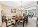 Elegant dining room with a chandelier and a view of the office at 1975 Fairway Close Ter, Lawrenceville, GA 30043