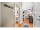 Light-filled entryway with views of the living space and bathroom featuring natural hardwood floors at 1975 Fairway Close Ter, Lawrenceville, GA 30043