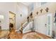 Inviting foyer with hardwood floors, a staircase, and natural light at 1975 Fairway Close Ter, Lawrenceville, GA 30043