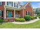 Charming front porch featuring a vibrant blue door and classic decor at 1975 Fairway Close Ter, Lawrenceville, GA 30043