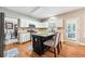 Bright kitchen with center island, granite counters, stainless appliances, and easy access to the backyard at 1975 Fairway Close Ter, Lawrenceville, GA 30043