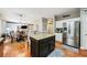 Modern kitchen features stainless steel appliances, an island with granite countertops, and hardwood floors at 1975 Fairway Close Ter, Lawrenceville, GA 30043