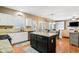 Stylish kitchen with white cabinets, granite countertops, and a center island at 1975 Fairway Close Ter, Lawrenceville, GA 30043