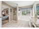 Large main bathroom with a glass shower, soaking tub, and double sink vanity, offering luxury and comfort at 1975 Fairway Close Ter, Lawrenceville, GA 30043