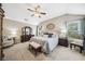 Comfortable main bedroom with vaulted ceiling, sitting area, and an en-suite bathroom at 1975 Fairway Close Ter, Lawrenceville, GA 30043