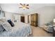 Spacious main bedroom featuring a ceiling fan, sitting area, and large closet, and ensuite bathroom at 1975 Fairway Close Ter, Lawrenceville, GA 30043