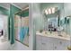 Bright bathroom featuring a shower and white vanity, and vintage-inspired sconces at 2117 Stephens Walk, Dunwoody, GA 30338