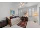 Bright bedroom features a trundle bed, desk, and large windows at 2117 Stephens Walk, Dunwoody, GA 30338