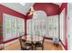 Bright breakfast nook featuring shuttered windows and a modern ceiling fan at 2117 Stephens Walk, Dunwoody, GA 30338