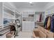 Large walk-in closet with built-in shelving and storage space at 2117 Stephens Walk, Dunwoody, GA 30338