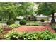 Inviting brick patio with benches surrounded by lush greenery, offering a relaxing community space at 2117 Stephens Walk, Dunwoody, GA 30338
