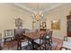 Spacious dining room featuring hardwood floors, chandelier, and ample seating for gatherings at 2117 Stephens Walk, Dunwoody, GA 30338