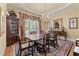Elegant dining room with chandelier, large window, and classic furnishings at 2117 Stephens Walk, Dunwoody, GA 30338