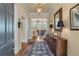 Warm and welcoming foyer with hardwood floors, elegant lighting, and a glimpse into the living spaces at 2117 Stephens Walk, Dunwoody, GA 30338