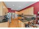 Well-lit kitchen featuring hardwood floors, granite counters and stainless steel appliances at 2117 Stephens Walk, Dunwoody, GA 30338