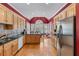 Bright kitchen with stainless steel appliances, an island, and an adjacent dining area at 2117 Stephens Walk, Dunwoody, GA 30338