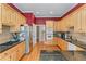 Spacious kitchen with light wood cabinetry, stainless steel appliances, and granite countertops at 2117 Stephens Walk, Dunwoody, GA 30338