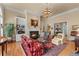 Bright living room boasts a fireplace, built-in bookshelves, and elegant decor at 2117 Stephens Walk, Dunwoody, GA 30338
