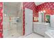 Main bathroom features a large glass shower, white cabinets, and bold wallpaper at 2117 Stephens Walk, Dunwoody, GA 30338