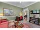 Inviting office with classic details, hardwood floors, and built-in shelving at 2117 Stephens Walk, Dunwoody, GA 30338
