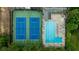 Aerial view featuring a pool with ample lounge chairs and tennis courts surrounded by mature trees at 380 Lamplighter Se Ln, Marietta, GA 30067