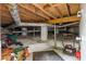 View of basement with utilities, cement supports, and lumber at 380 Lamplighter Se Ln, Marietta, GA 30067