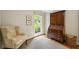 Sitting room features a chair, area rug and a large window at 380 Lamplighter Se Ln, Marietta, GA 30067