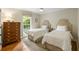 Bedroom featuring two twin beds, a chest of drawers and a ceiling fan at 380 Lamplighter Se Ln, Marietta, GA 30067