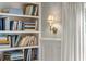 Close up on the built-in bookshelves and sconce lighting in the home's sitting room at 380 Lamplighter Se Ln, Marietta, GA 30067