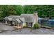 Clubhouse exterior with well-maintained landscaping, adjacent tennis courts, and a view of the community pool at 380 Lamplighter Se Ln, Marietta, GA 30067