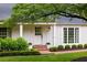 Close-up of home's entrance with brick steps and walkway and nicely manicured bushes at 380 Lamplighter Se Ln, Marietta, GA 30067