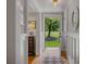 Entryway with hardwood floors and white-paneled walls, leading to a view of the lush front yard at 380 Lamplighter Se Ln, Marietta, GA 30067