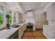 Bright kitchen featuring hardwood floors, white cabinets, granite countertops and stainless steel appliances at 380 Lamplighter Se Ln, Marietta, GA 30067