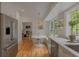 Kitchen boasts stainless steel appliances, hardwood floors, eat in nook, and views into a cozy living room at 380 Lamplighter Se Ln, Marietta, GA 30067