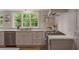 Bright kitchen featuring a marble countertop, stainless steel appliances, and view of the lush outdoors at 380 Lamplighter Se Ln, Marietta, GA 30067