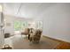 Comfortable living room boasts a brick fireplace, French doors to the balcony, and hardwood floors at 380 Lamplighter Se Ln, Marietta, GA 30067