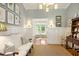 Sitting room with wainscoting, hardwood floors, comfortable seating, and decorative furnishings at 380 Lamplighter Se Ln, Marietta, GA 30067