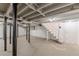 Unfinished basement featuring painted walls, exposed ceiling, duct work and staircase to upper level at 442 Mountain Park Trl, Stone Mountain, GA 30087