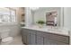 Bright, updated bathroom offers double sinks with modern fixtures and plenty of storage at 442 Mountain Park Trl, Stone Mountain, GA 30087