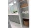 Charming bathroom featuring double vanity, decorative shelving, and bright natural lighting at 442 Mountain Park Trl, Stone Mountain, GA 30087