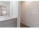 Beautiful bathroom with walk-in shower, sleek fixtures, and stunning marble tile at 442 Mountain Park Trl, Stone Mountain, GA 30087