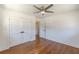 Bedroom with hardwood floors, closet, and ceiling fan at 442 Mountain Park Trl, Stone Mountain, GA 30087