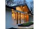 Inviting exterior view of home illuminated at dusk, highlighting the architectural details and warm lighting at 442 Mountain Park Trl, Stone Mountain, GA 30087